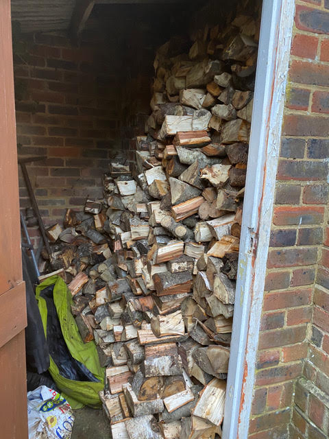 Gardener turfing job log pile